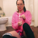 A girl wearing glasses gives herself an enema and expels it while wearing panties and standing in her bath tub. Presented in 720P HD. 187MB, MP4 file. About 13 minutes.